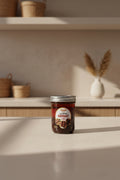 Jar of marinade on a light surface with a neutral background